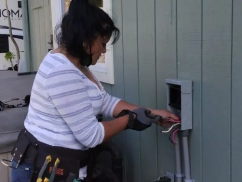 Licensed electrician wiring an exterior subpanel in Mecca