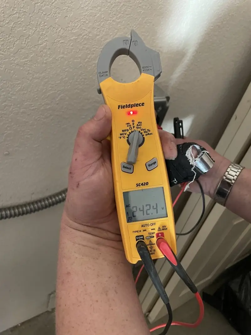 Voltage testing with clamp meter during Whole House Surge Protector in Mecca